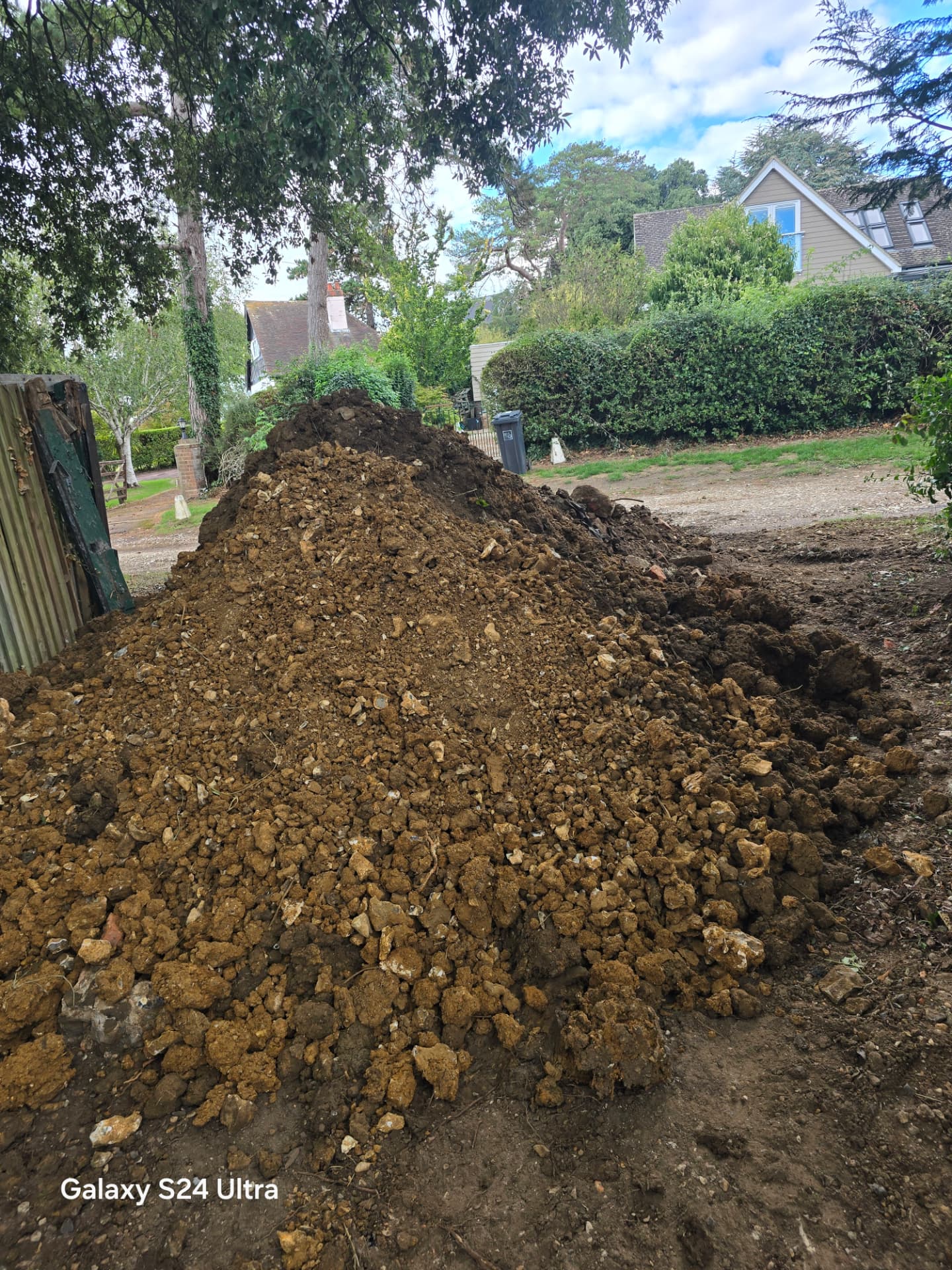 Excavated spoil heap ready for grab-loader muckaway in Worthing