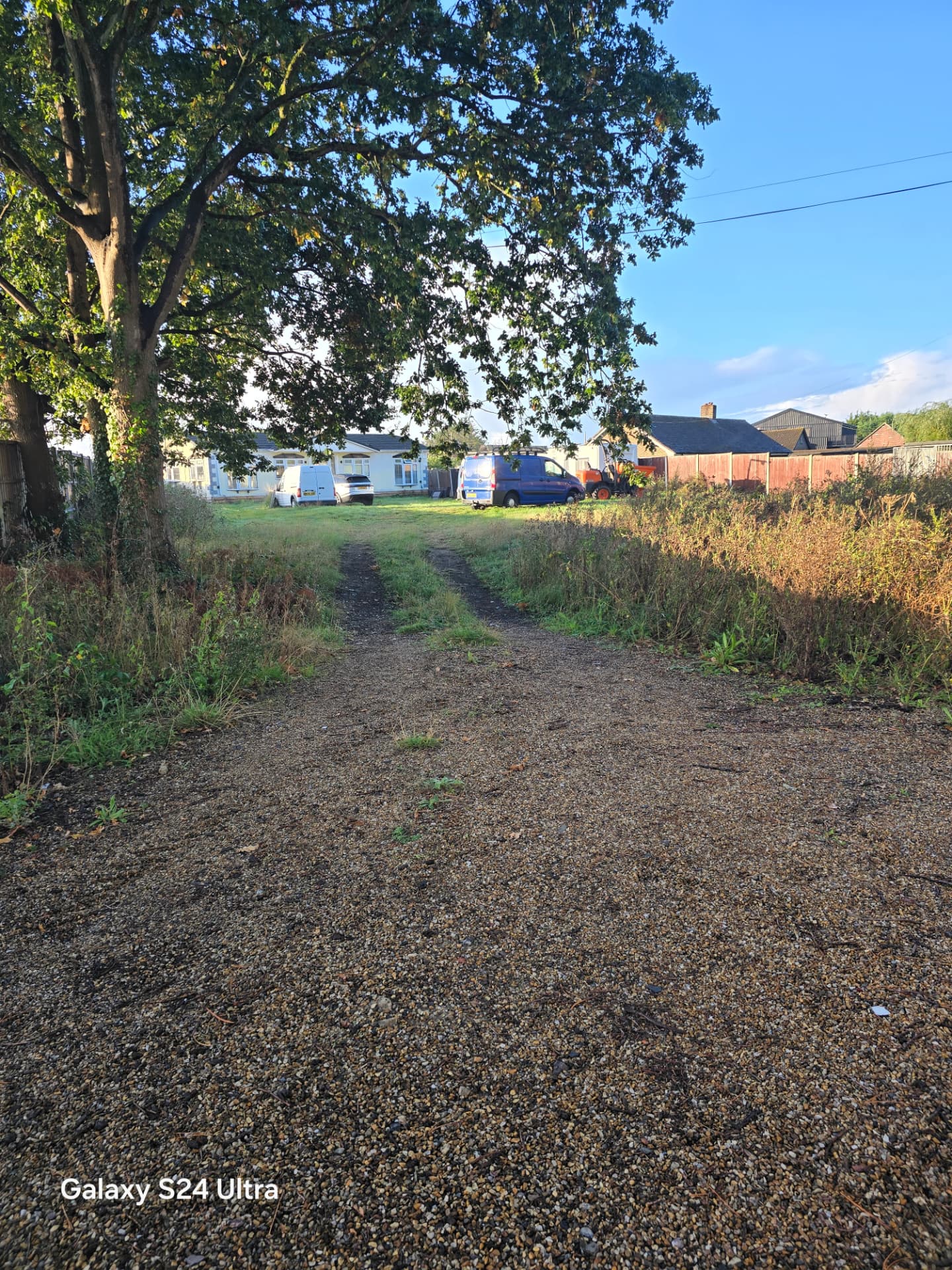 Wide view of the grassy plot and access track before groundworks near Chichester and Emsworth