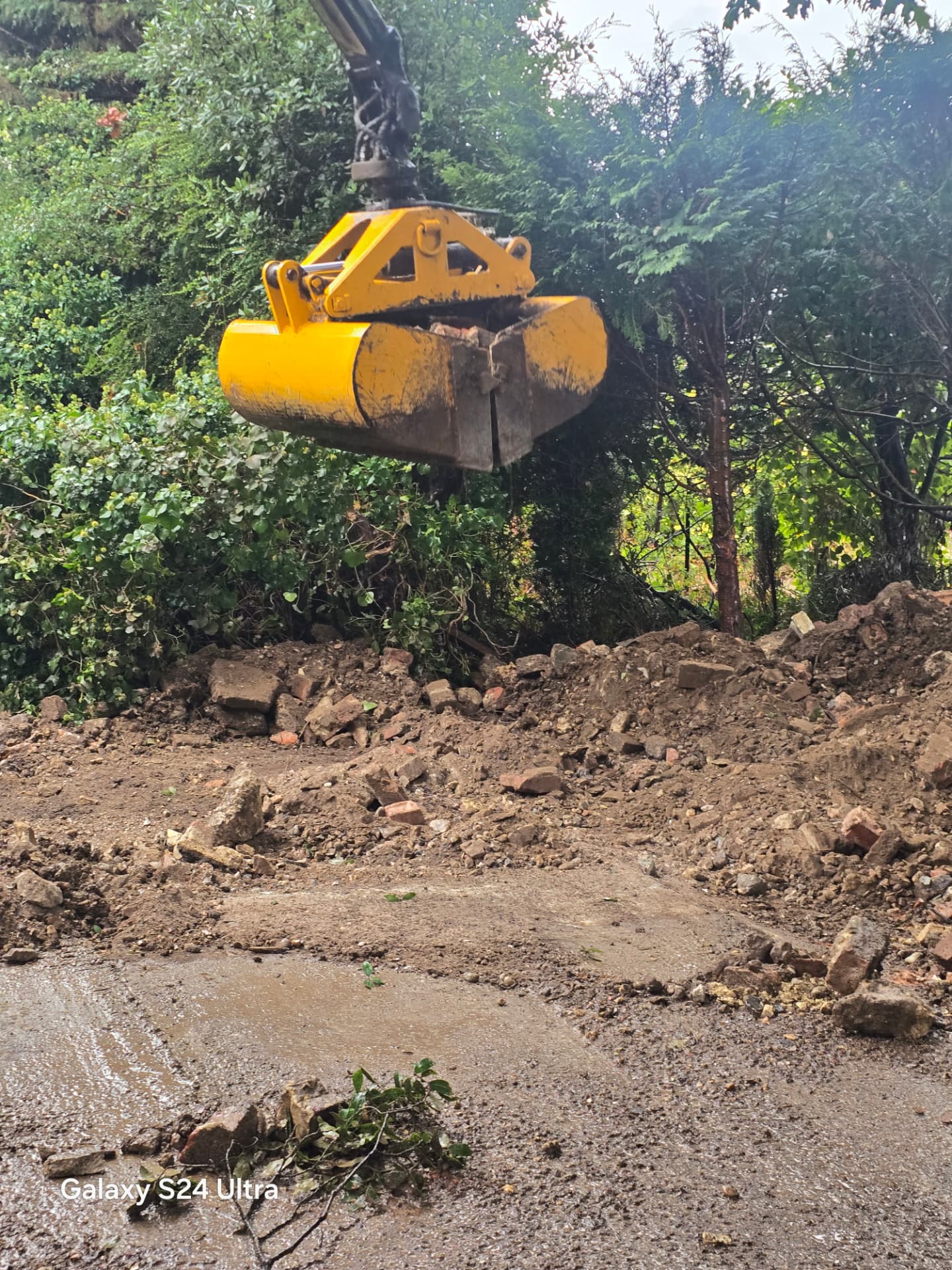 Grab loader removing excavated material from site in Worthing